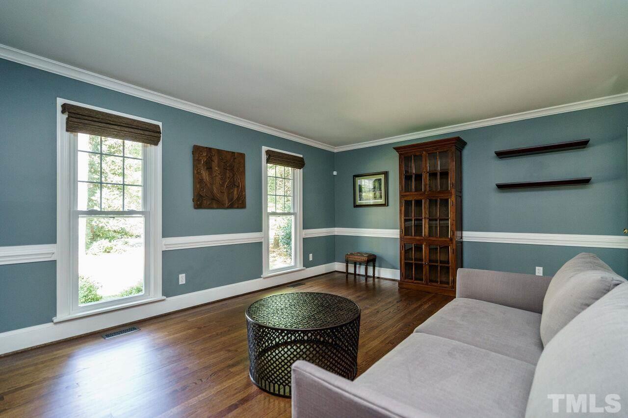 11000 Coachmans Way Raleigh, NC 27614 - Photo 4 of 30 Living Room/Study with hardwoods floors, crown and chair rail.