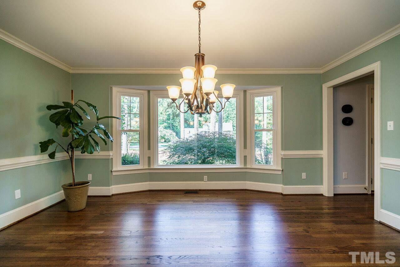 11000 Coachmans Way Raleigh, NC 27614 - Photo 6 of 30 Dining Room with hardwoods floors, crown and chair rail.