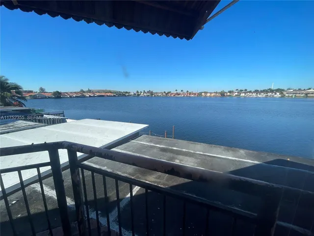 a view of a balcony with furniture