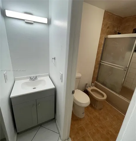 a bathroom with a sink and toilet