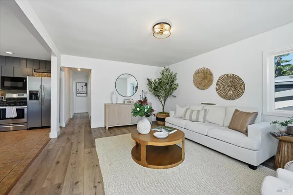 a living room with furniture and a clock