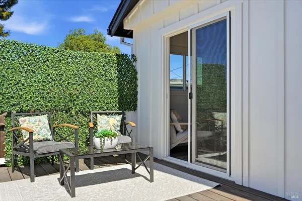 a outdoor space with lots of furniture and shower