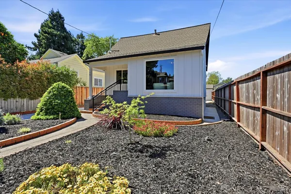 a front view of house with small garden
