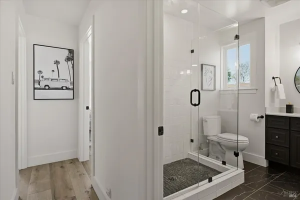 a bathroom with a toilet sink and shower