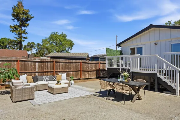 a view of a patio with couches table and chairs