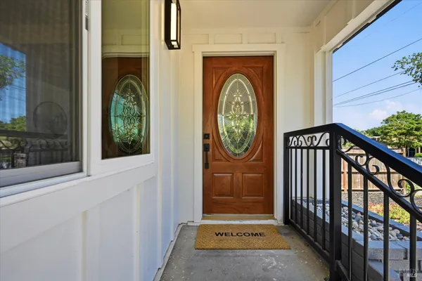 a view of a entryway door with wooden floor