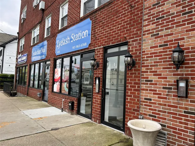 a view of a brick building with a sink and a toilet