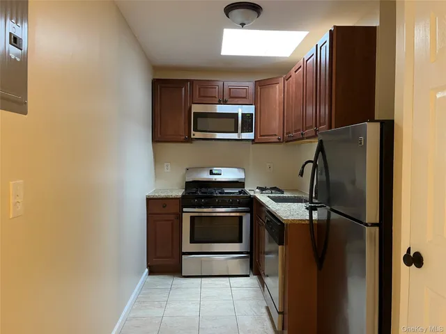 a kitchen with a stove microwave and refrigerator
