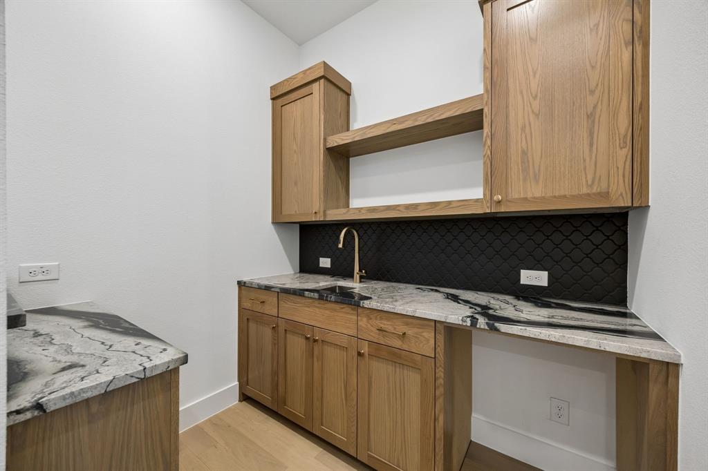 1120 Whirlabout Road Prosper, TX 75078 - Photo 6 of 25 Located jut off the family room, this wonderful wet bar provides an ideal entertaining space.