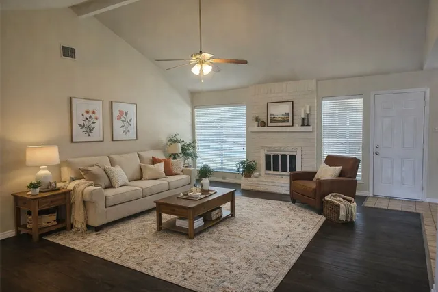 a living room with furniture and a fireplace