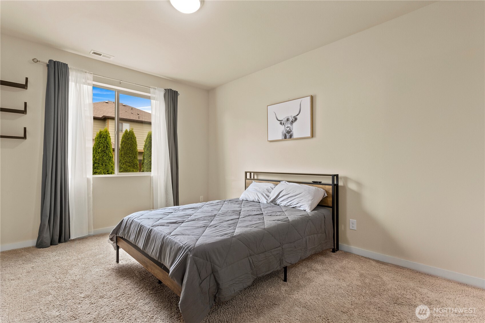 396 South Sergeant Street Buckley, WA 98321 - Photo 15 of 39 a bedroom with a bed and a window