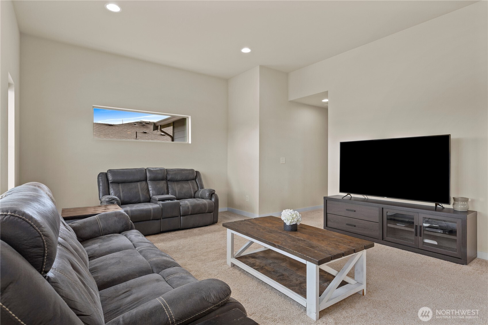 396 South Sergeant Street Buckley, WA 98321 - Photo 20 of 39 a living room with furniture and a flat screen tv