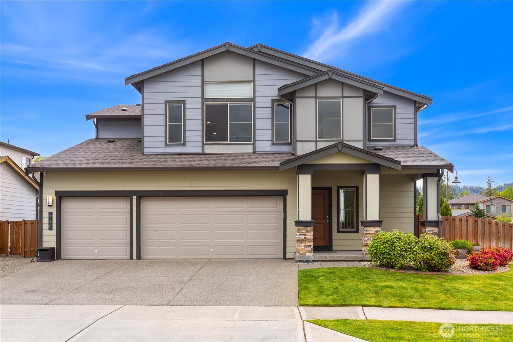 396 South Sergeant Street Buckley, WA 98321 - Photo 2 of 39 a front view of a house with a yard and garage
