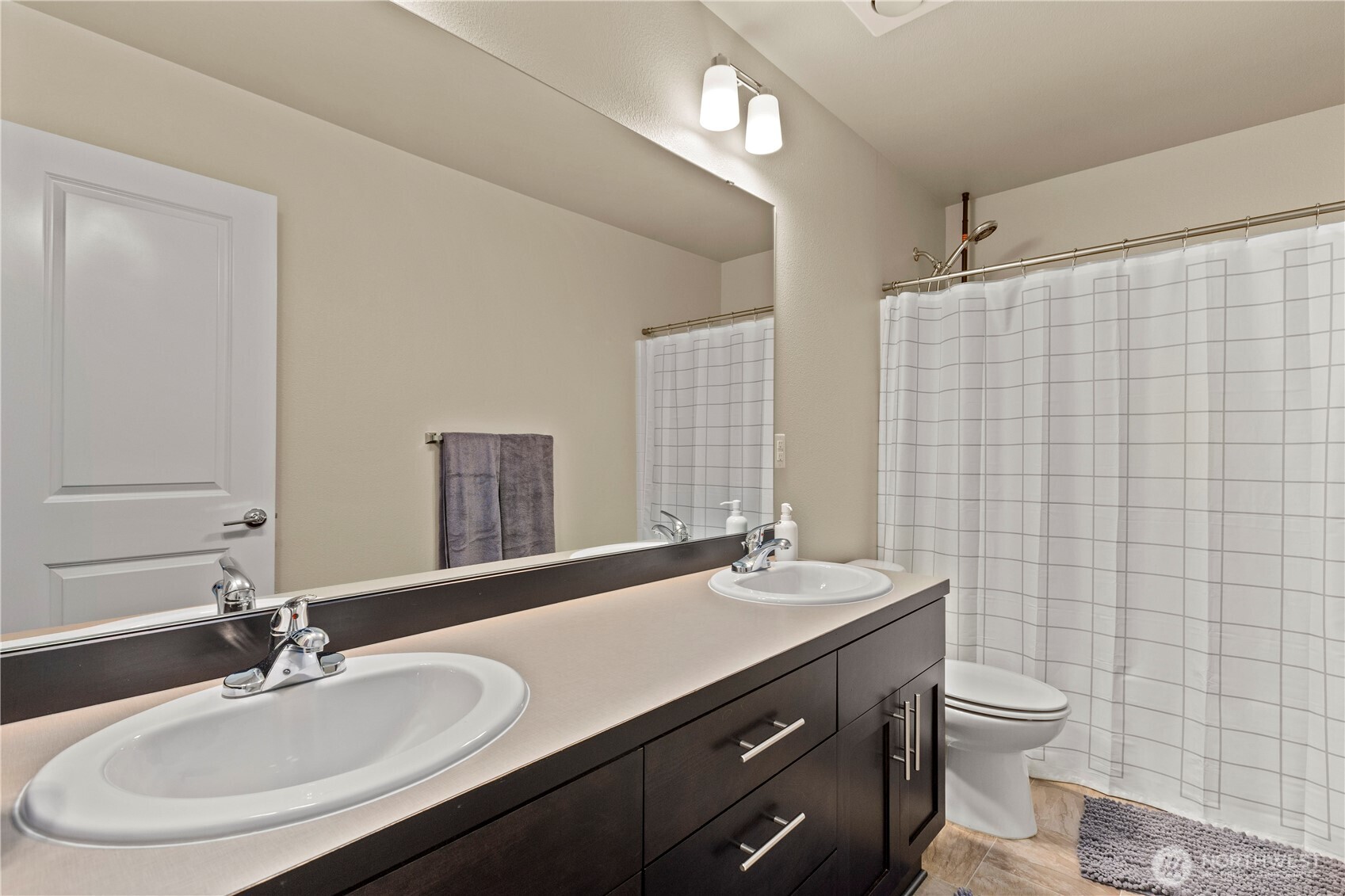 396 South Sergeant Street Buckley, WA 98321 - Photo 22 of 39 a bathroom with a double vanity sink toilet and a mirror