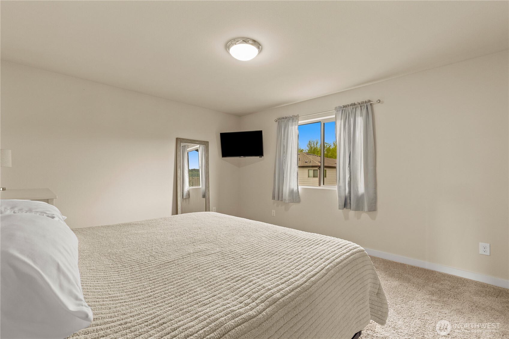 396 South Sergeant Street Buckley, WA 98321 - Photo 25 of 39 a bedroom with a large bed and a window