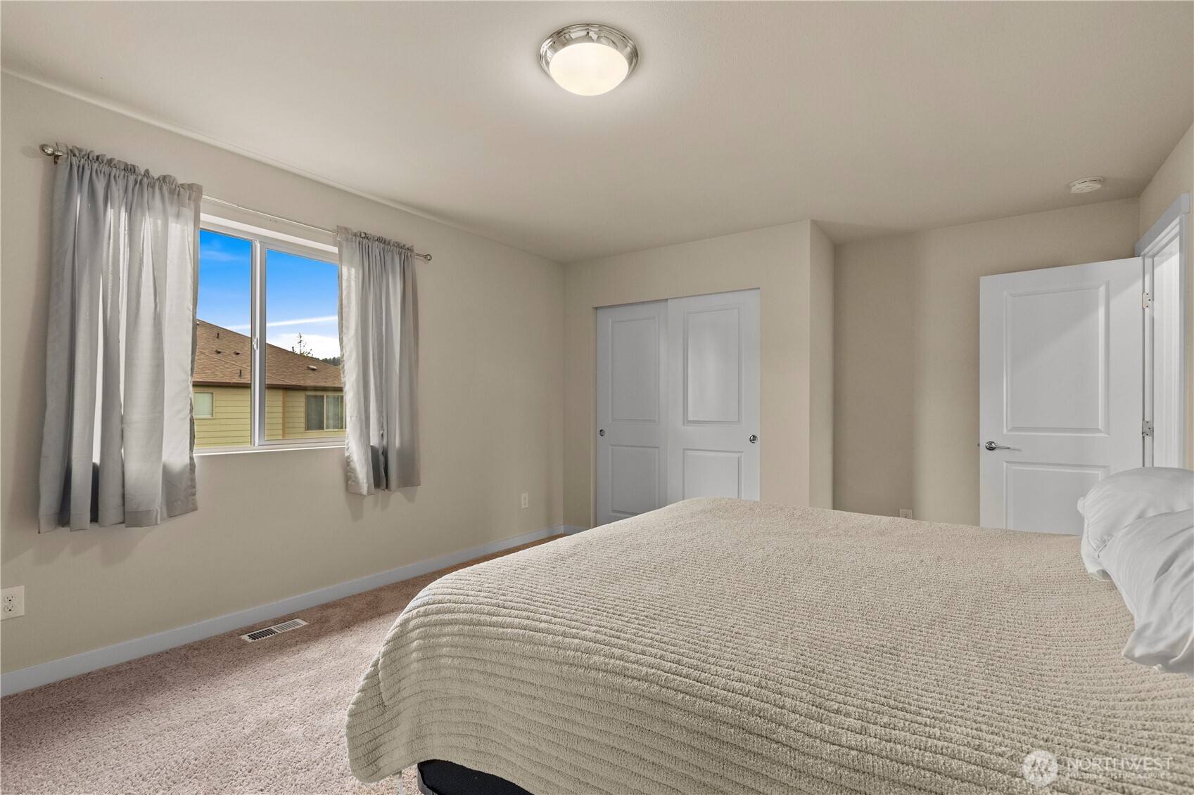 396 South Sergeant Street Buckley, WA 98321 - Photo 27 of 39 a bedroom with a bed and a window