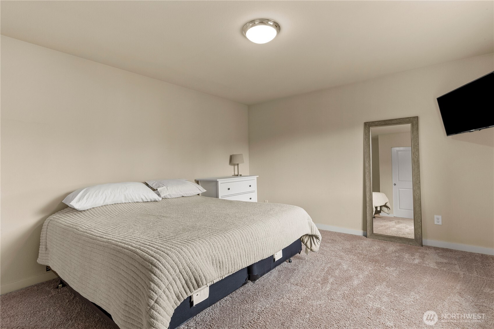 396 South Sergeant Street Buckley, WA 98321 - Photo 28 of 39 a bedroom with a bed and a flat screen tv