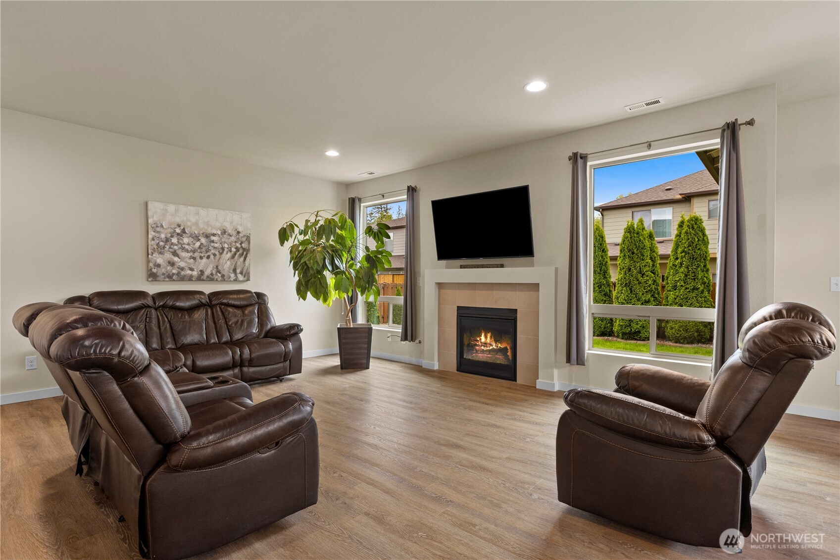396 South Sergeant Street Buckley, WA 98321 - Photo 3 of 39 a living room with furniture a flat screen tv and a fireplace
