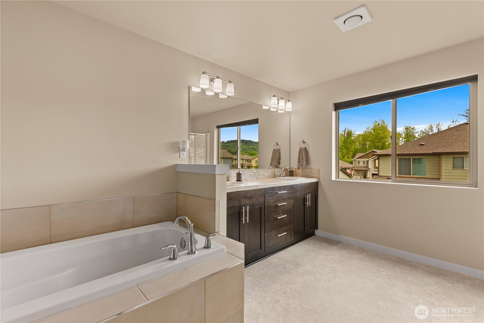 396 South Sergeant Street Buckley, WA 98321 - Photo 32 of 39 a bathroom with a tub sink and mirror