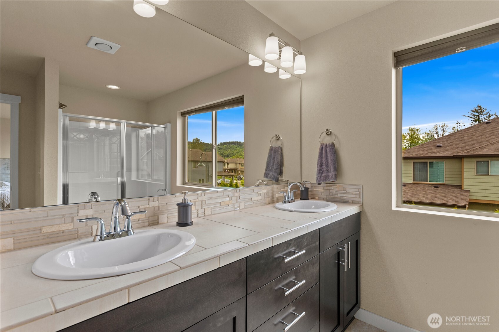 396 South Sergeant Street Buckley, WA 98321 - Photo 33 of 39 a bathroom with a double vanity sink and a mirror