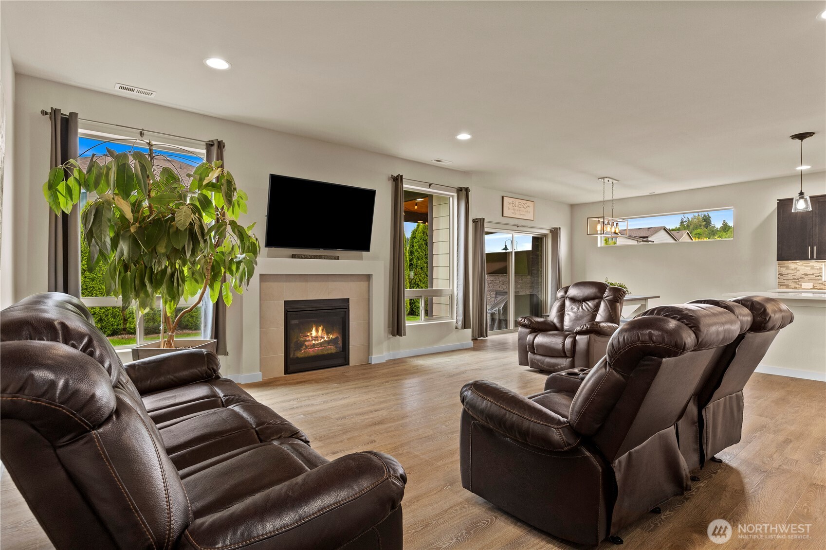 396 South Sergeant Street Buckley, WA 98321 - Photo 4 of 39 a living room with furniture a flat screen tv and a fireplace