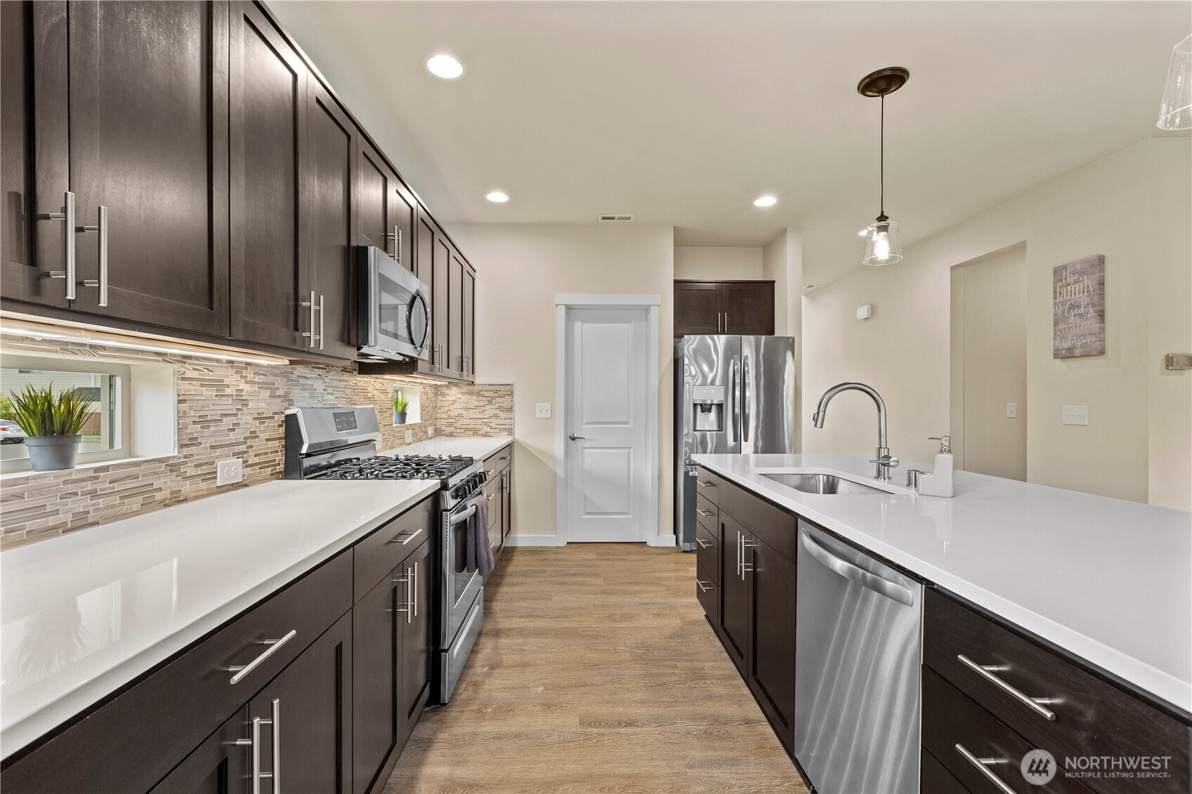 396 South Sergeant Street Buckley, WA 98321 - Photo 6 of 39 a kitchen with stainless steel appliances granite countertop lots of counter space a sink and cabinets