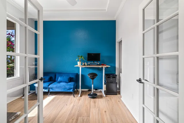 a view of a livingroom with furniture and staircase
