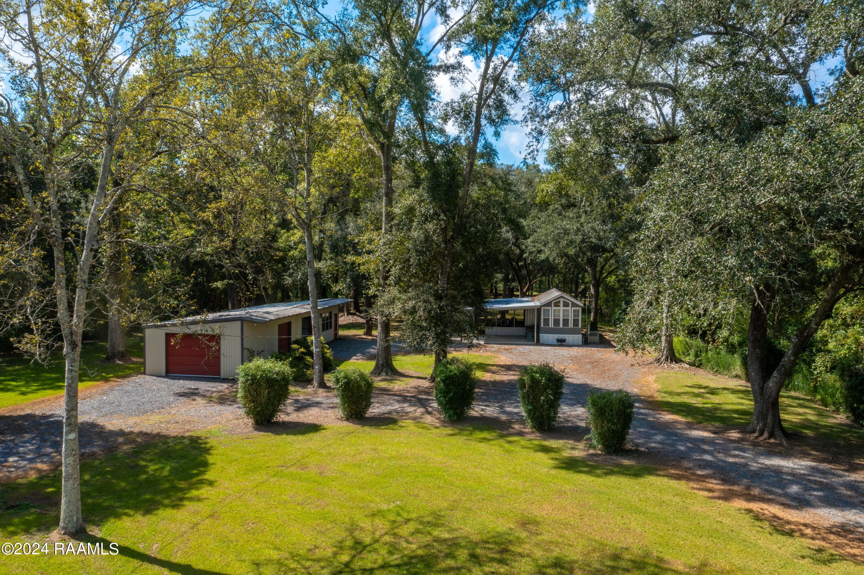 1082 Herman Dupuis Road Breaux Bridge, LA 70517 - Photo 2 of 40 View of both homes from road