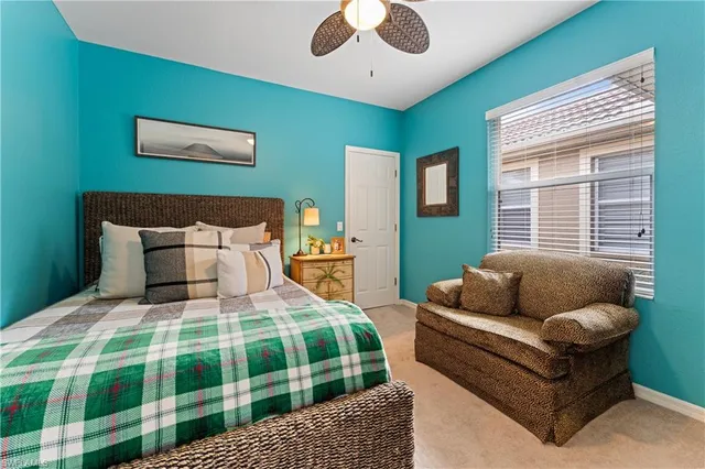 a bedroom with a bed and a couch