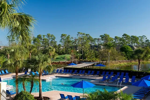 a view of swimming pool with outdoor seating