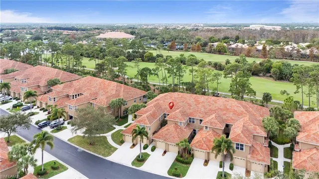 an aerial view of lake with residential house