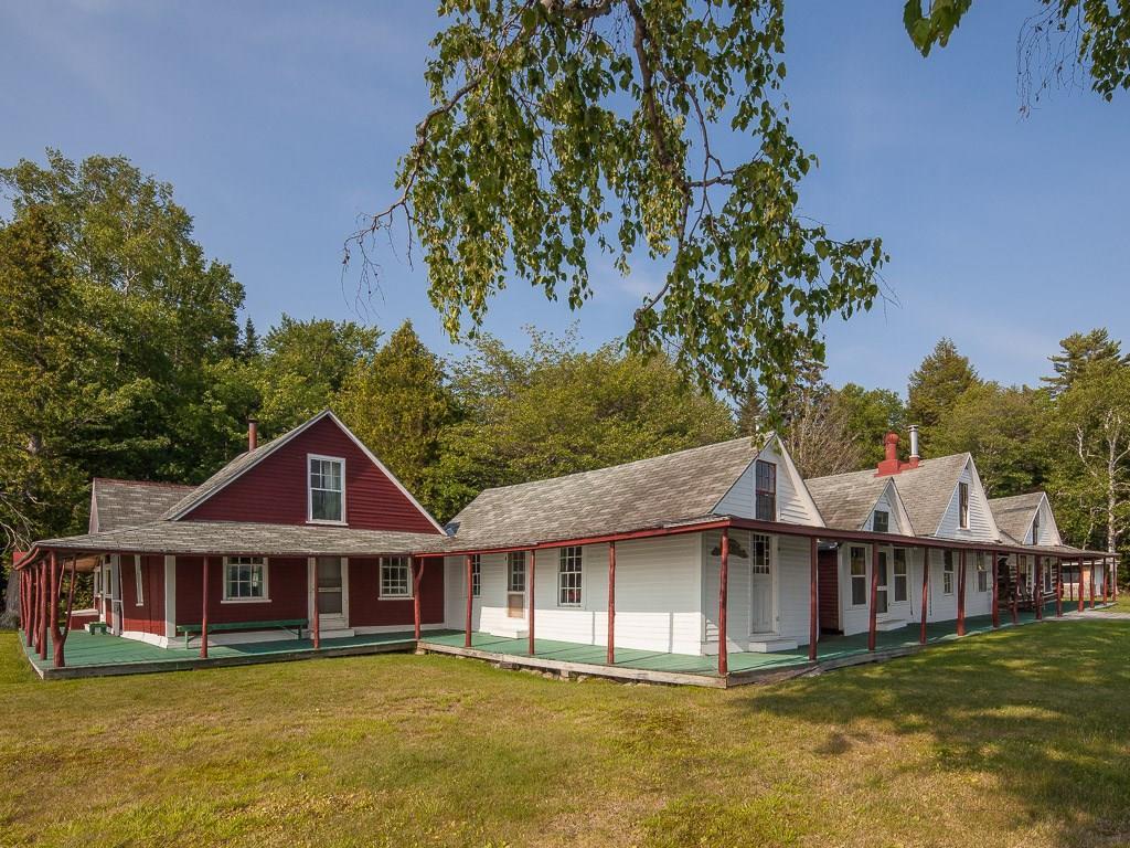 10 Upper Dam Road Oquossoc, ME 04964 - Photo 10 of 35 children's cabin in front (red).