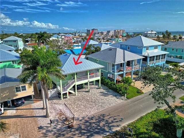 a view of a chairs and table in a patio