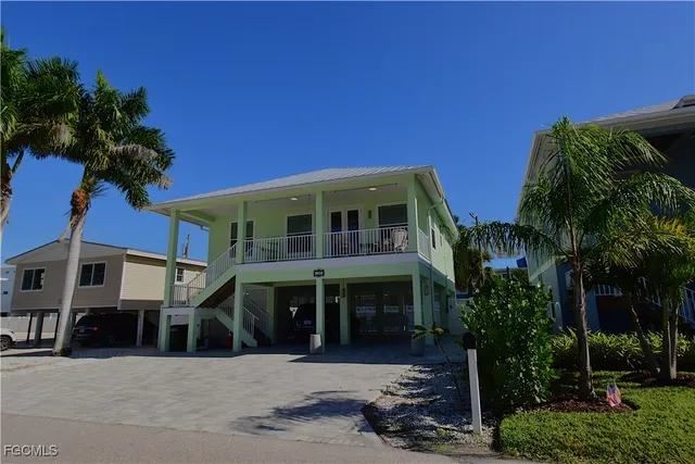 a front view of a building with garden