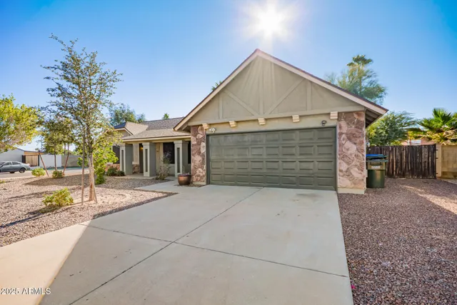a front view of house with garage and yard
