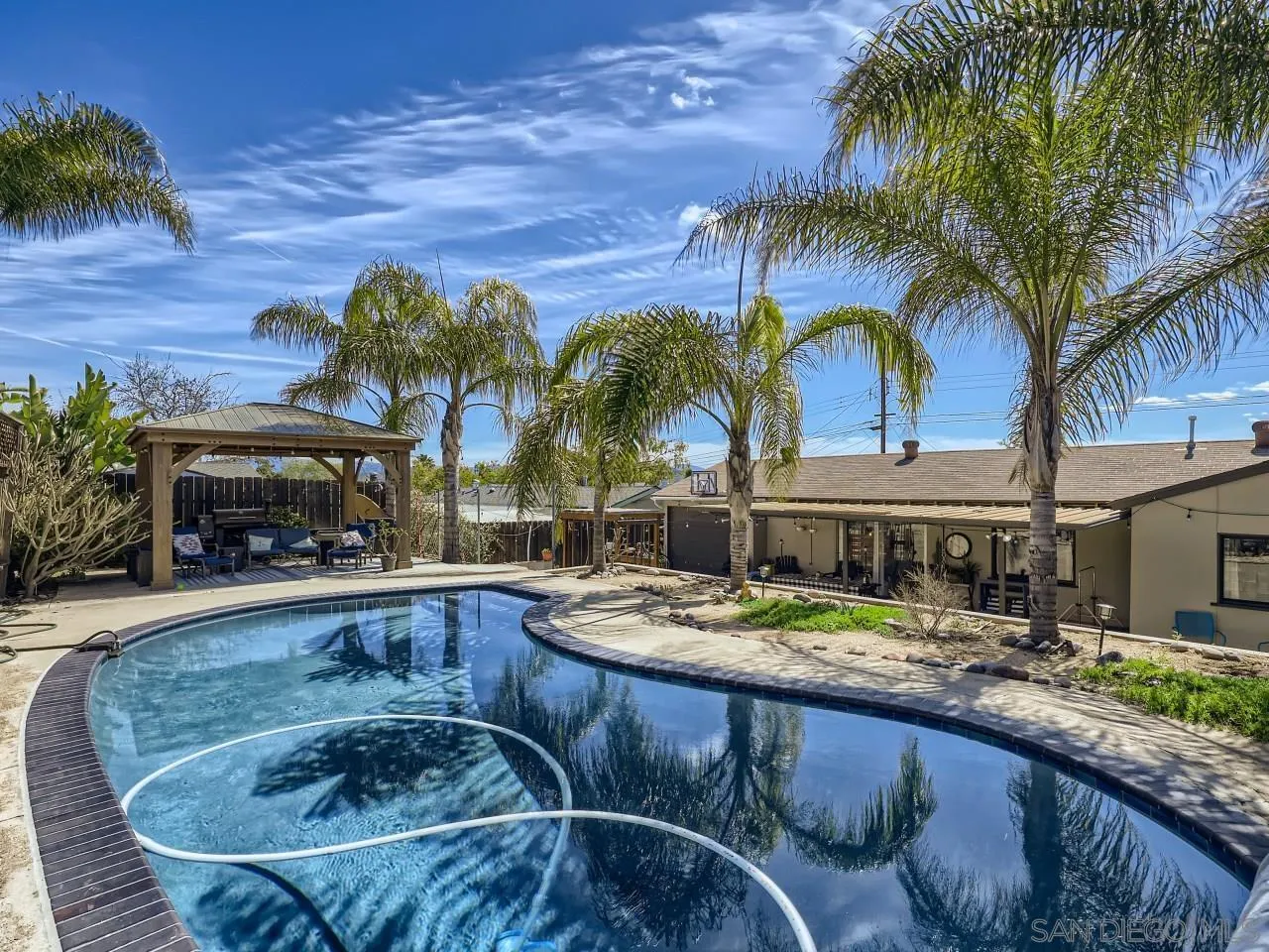 9456 Domer Road Santee, CA 92071 - Photo 18 of 30 a swimming pool with outdoor seating and yard