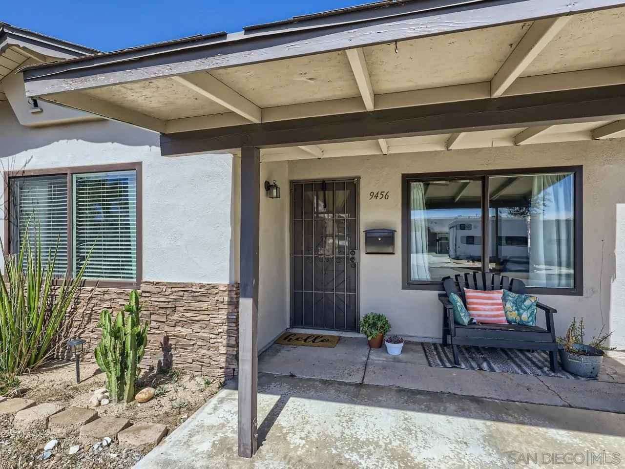 9456 Domer Road Santee, CA 92071 - Photo 28 of 30 a bench is sitting in front of a building
