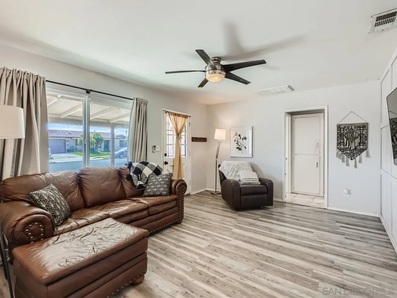 9456 Domer Road Santee, CA 92071 - Photo 3 of 30 a living room with furniture and a large window