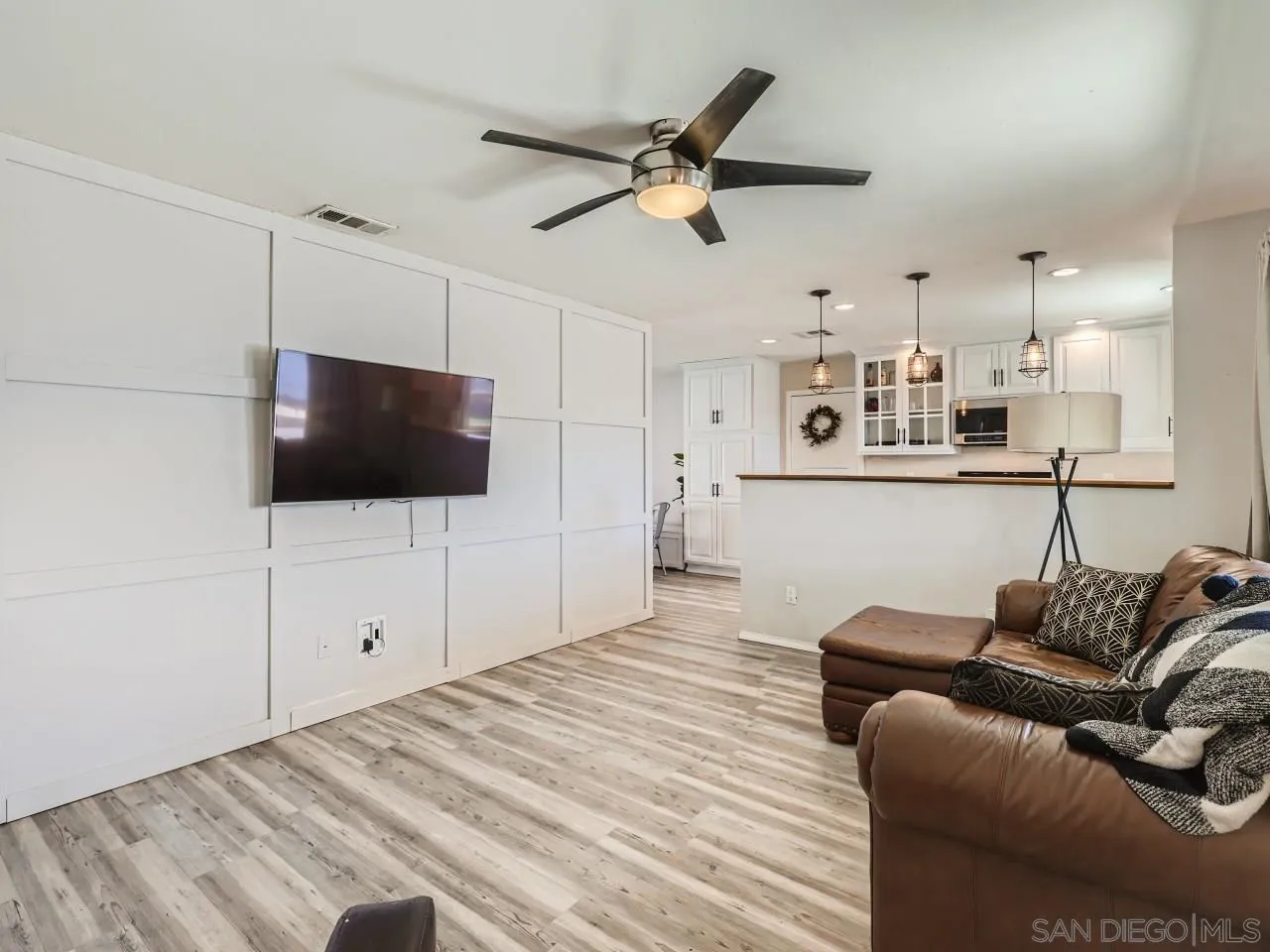 9456 Domer Road Santee, CA 92071 - Photo 4 of 30 a living room with furniture and a flat screen tv
