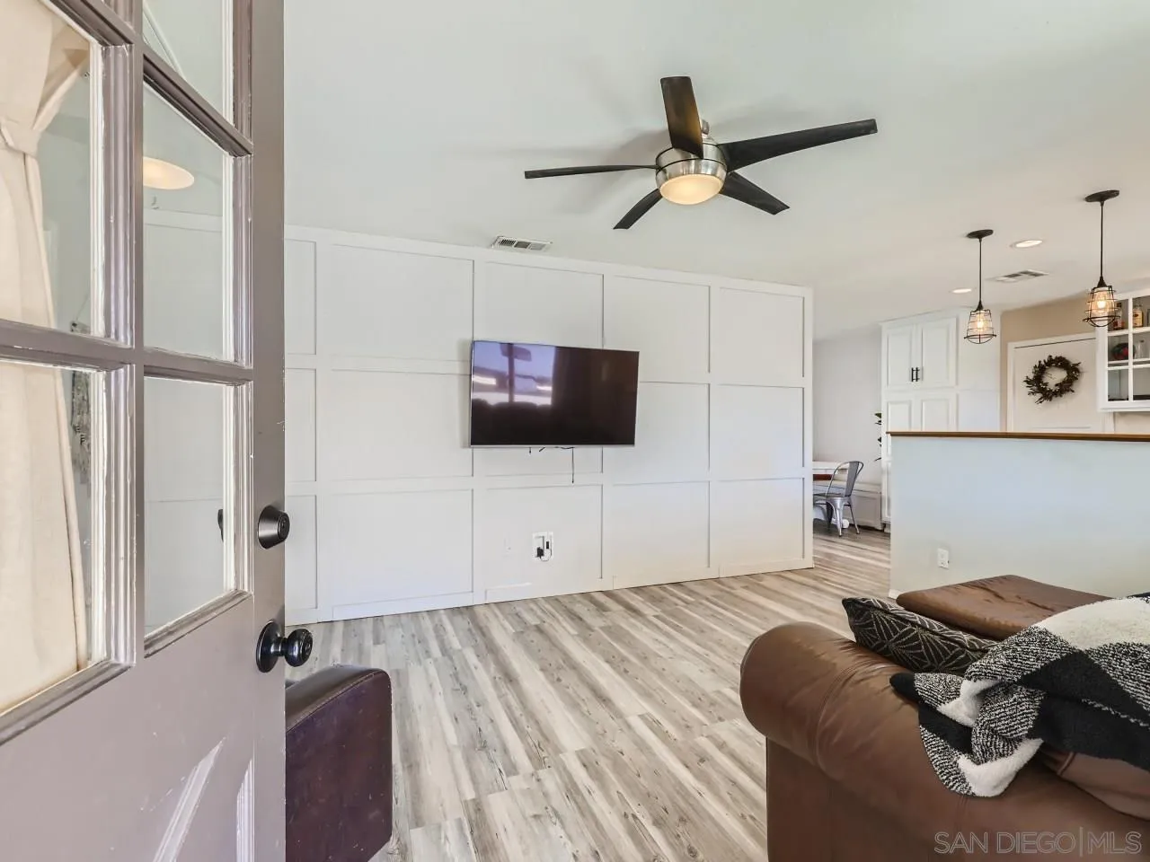 9456 Domer Road Santee, CA 92071 - Photo 5 of 30 a living room with furniture and a flat screen tv