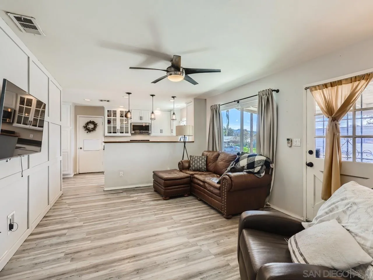 9456 Domer Road Santee, CA 92071 - Photo 6 of 30 a living room with furniture and a wooden floor