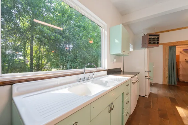 a bathroom with a sink and a shower curtain