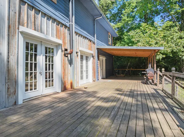a bathroom with a sink mirror vanity and toilet