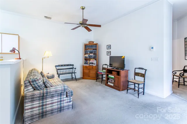 a living room with furniture and a lamp
