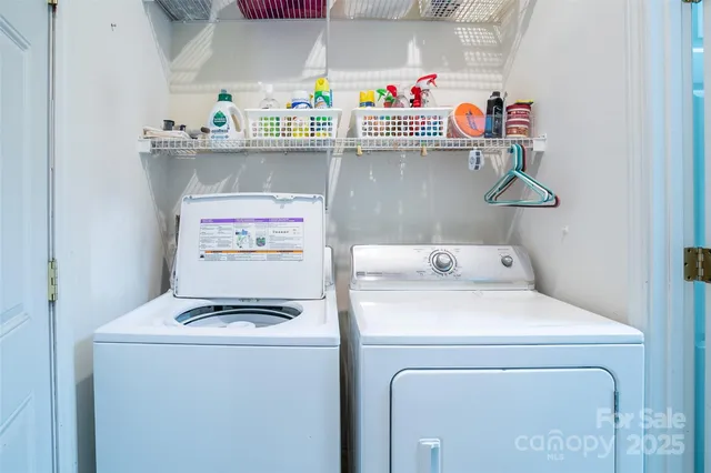 a view of an empty room with windows and balcony