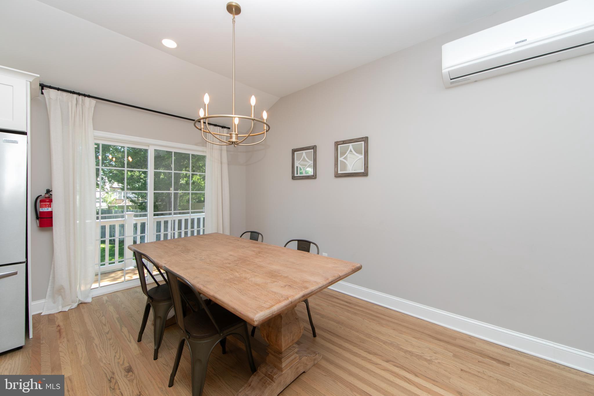 507 Howard Road Cherry Hill, NJ 08034 - Photo 12 of 45 Seating with sliding glass doors to the deck