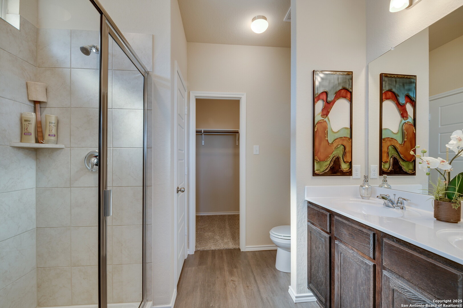 4947 Blue Ranch San Antonio, TX 78222 - Photo 12 of 27 a bathroom with a double vanity sink and a mirror