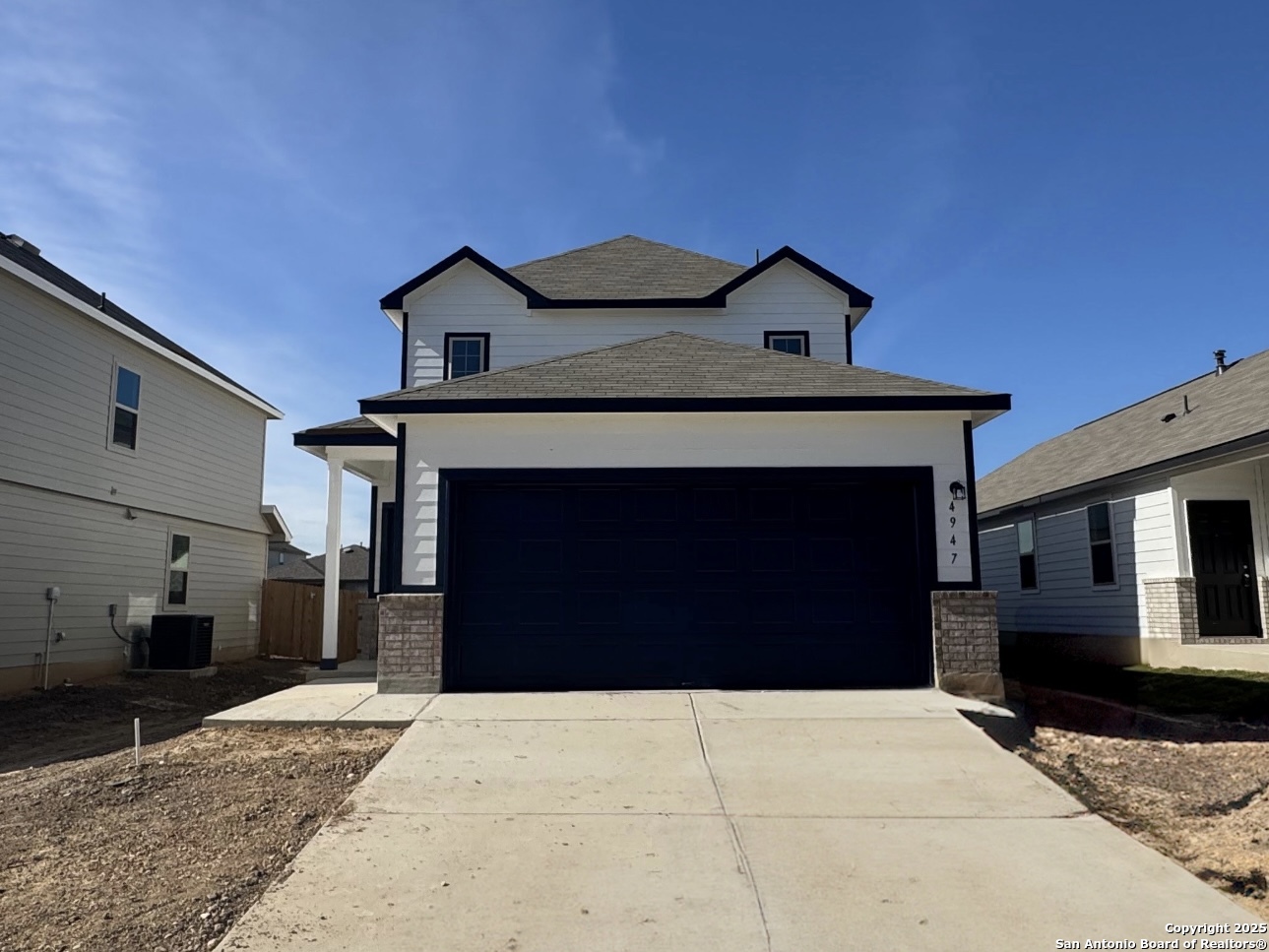 4947 Blue Ranch San Antonio, TX 78222 - Photo 2 of 27 a front view of a house with a garage