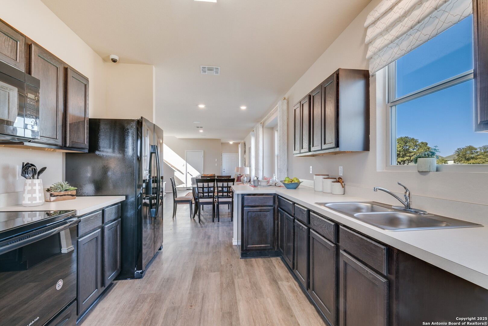 4947 Blue Ranch San Antonio, TX 78222 - Photo 10 of 27 a kitchen with lots of counter top space and stainless steel appliances