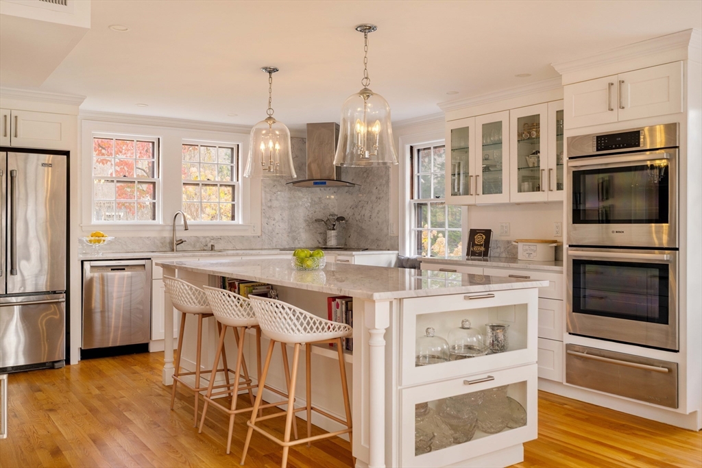 30 Prospect Street Winchester, MA 01890 - Photo 17 of 42 a kitchen with stainless steel appliances granite countertop a stove and a refrigerator